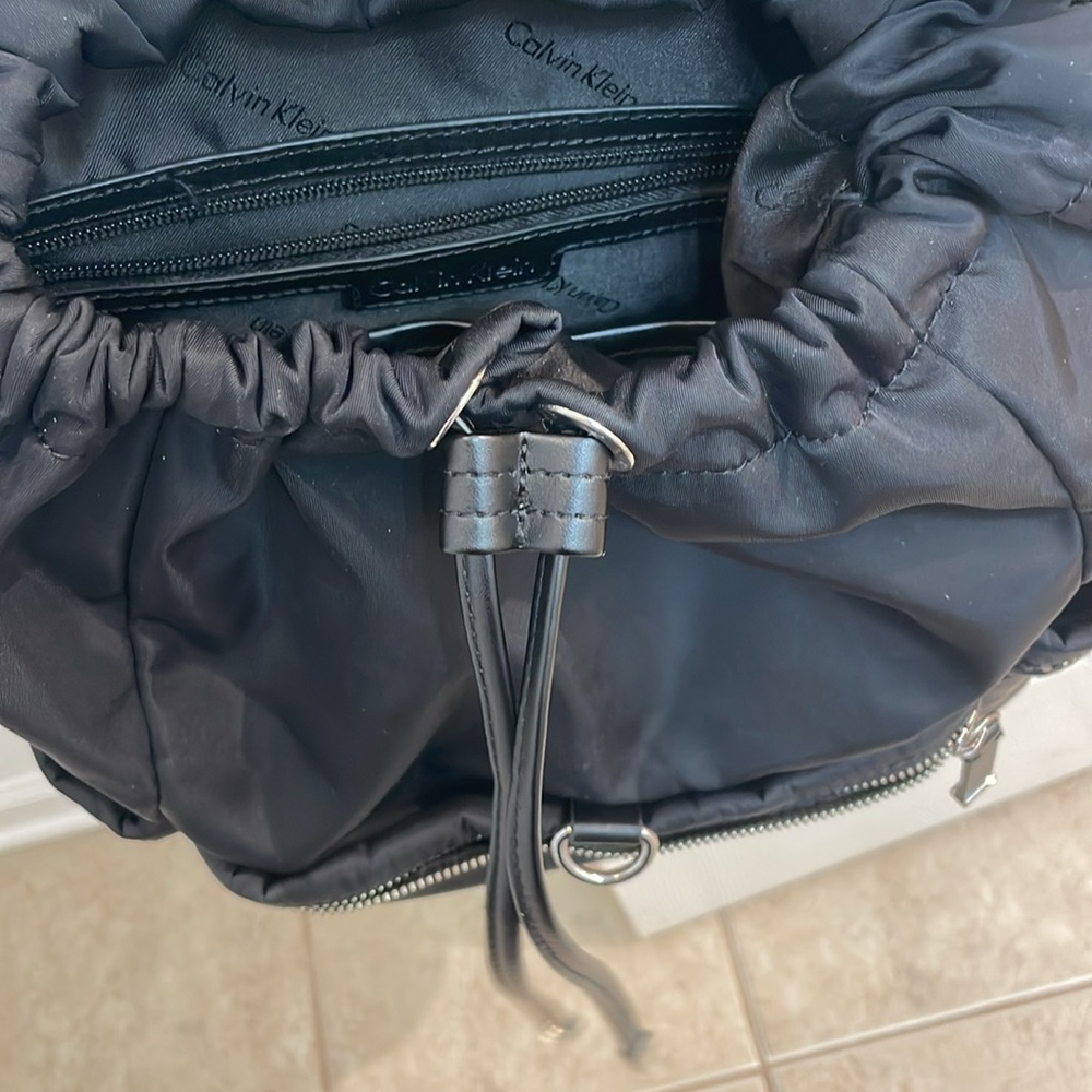 CALVIN KLEIN // black fashion backpack // fold over // TONS of zipper pockets - Picture 14 of 16